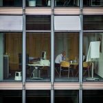 man sitting on chair inside room